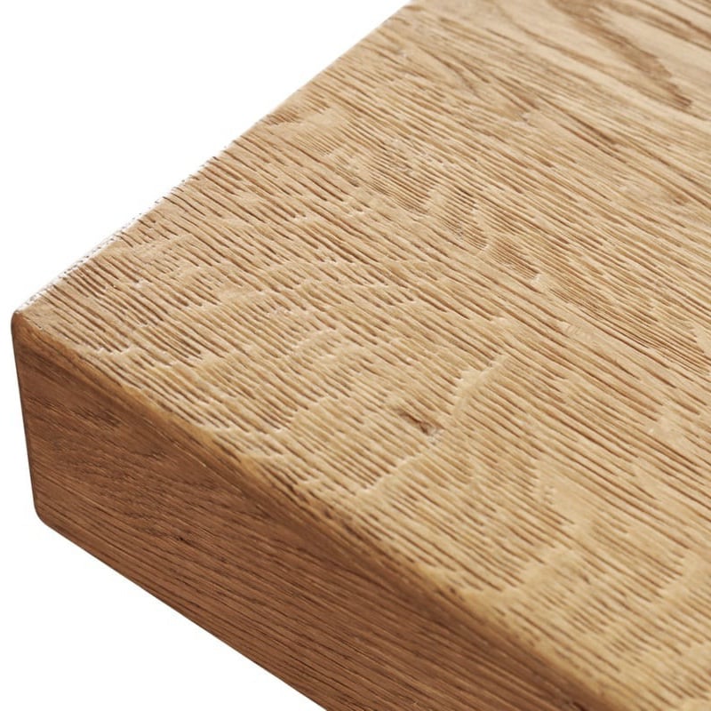 Rustic oak dining table edge with natural grain and hand-finished look