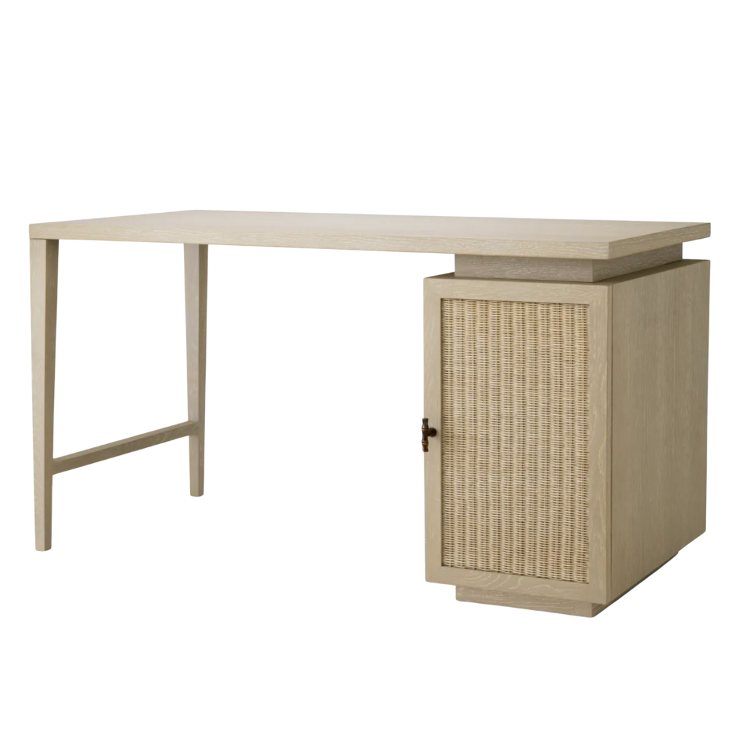 Light oak desk with woven rattan cabinet door and slim modern frame.