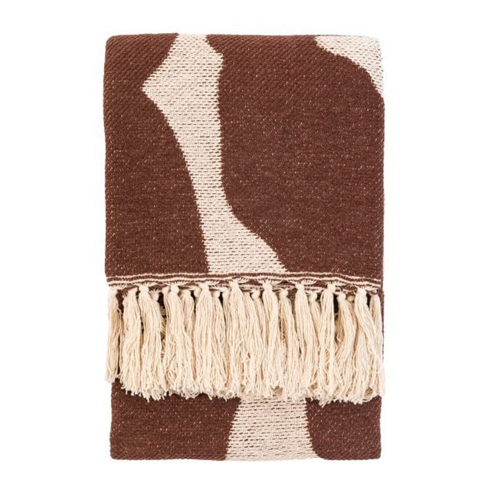 Folded brown and cream woven throw blanket with tassel detailing, modern geometric design.