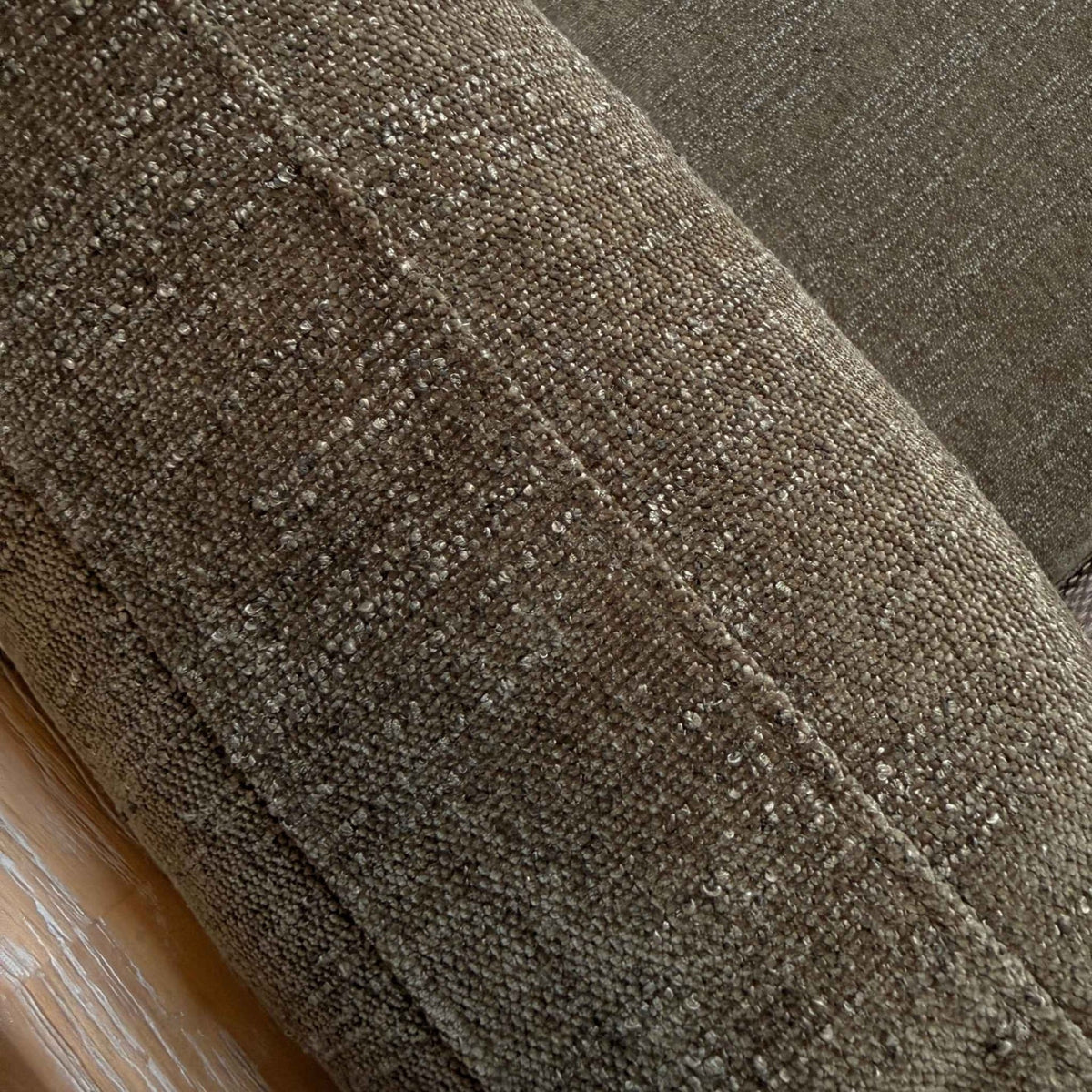 Close-up of the green textured upholstery fabric on the Chadlington Accent Chair