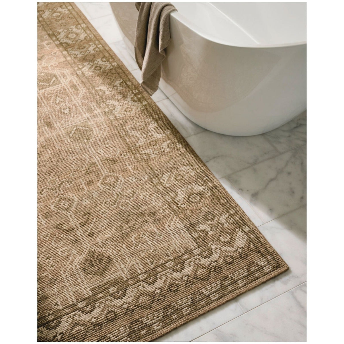 Edge detail of Tulu hand-knotted rug highlighting artisan craftsmanship and muted colour blend