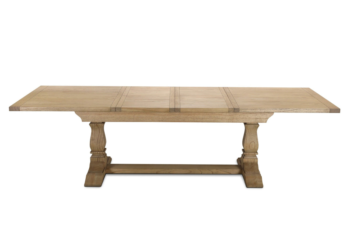 Solid oak farmhouse dining table with pedestal legs and natural wood finish