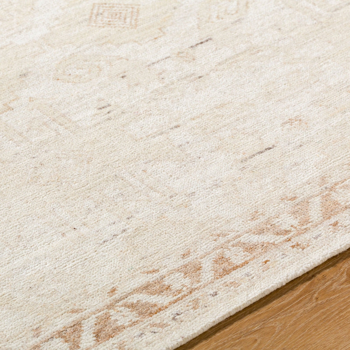 Close up of Agora rug texture showing artisan hand-knotted wool weave with subtle neutral tones