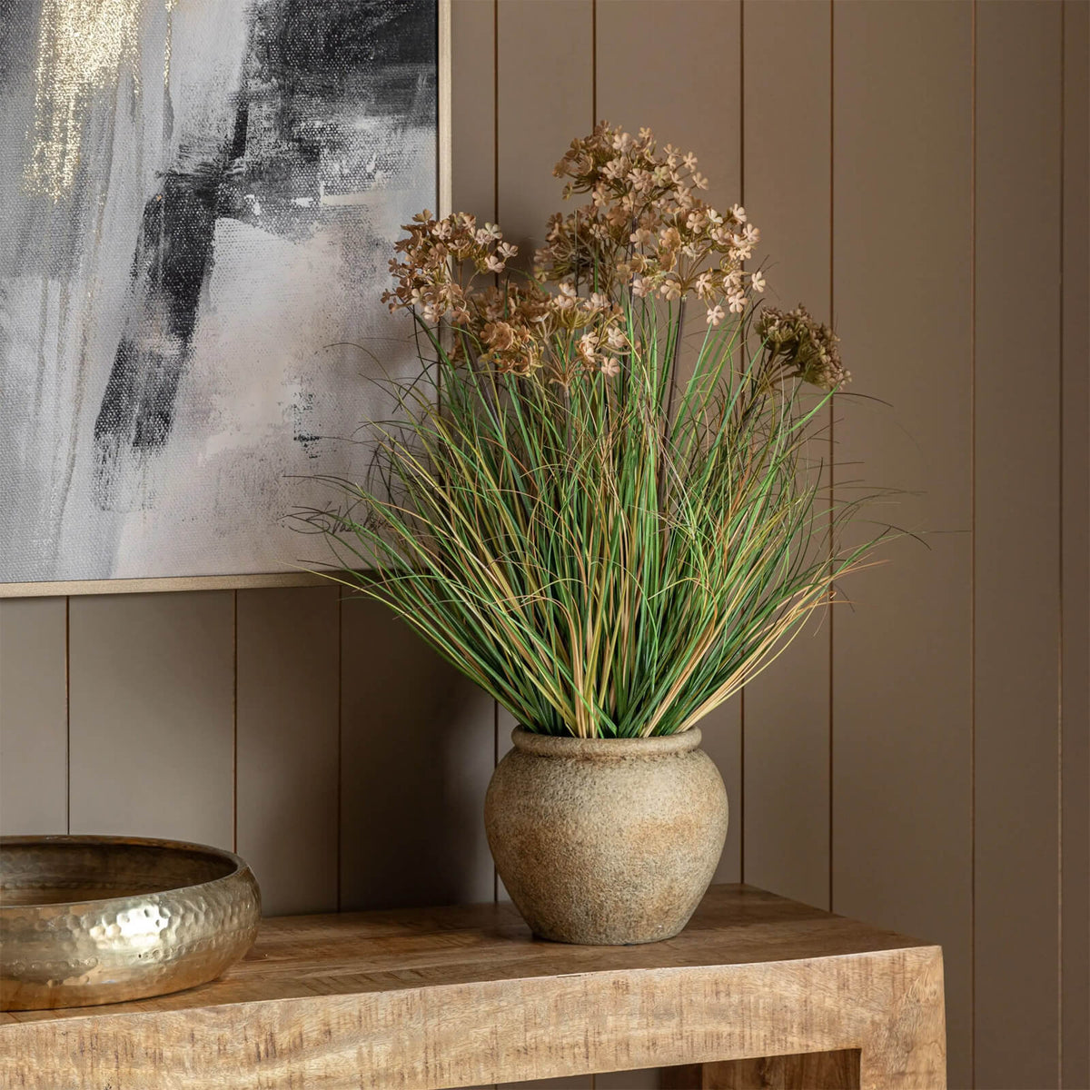 Potted Grass Flowers in Rustic Pot